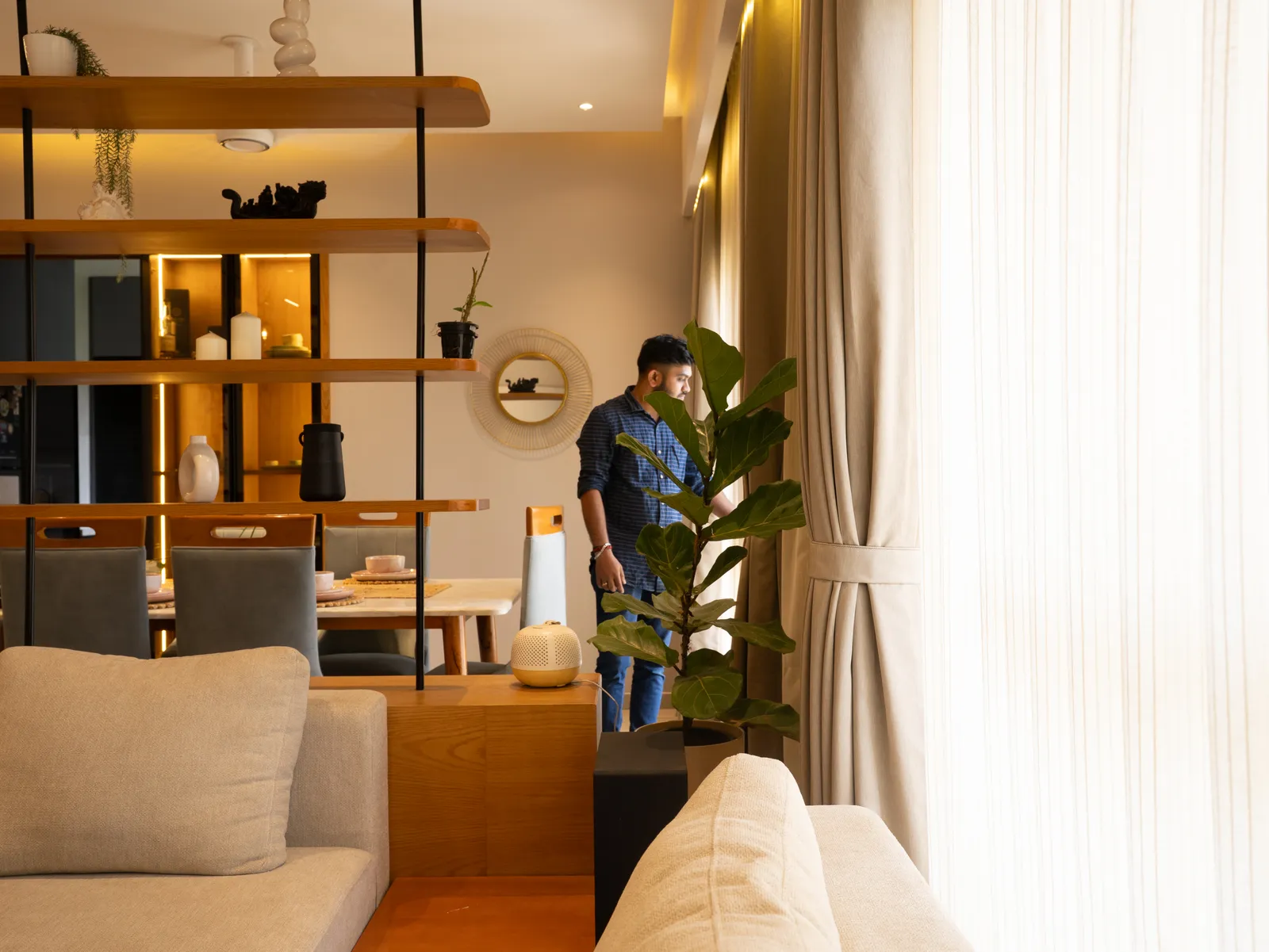Suspended oak shelving partition between living and dining — Amlan's Residence